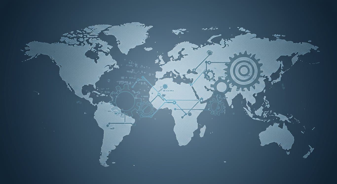 Interconnected gears and circuits on a world map, representing global technology and business.